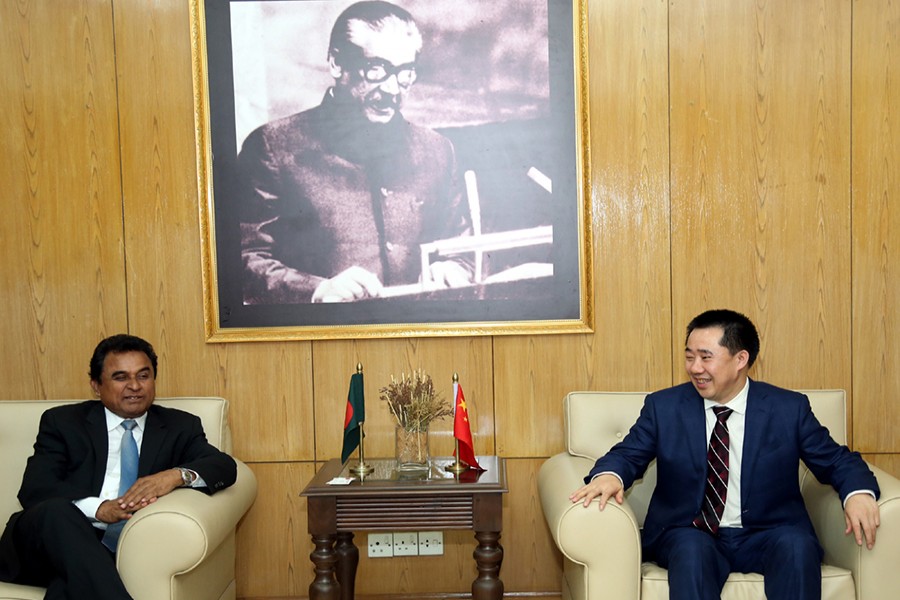 Chinese Ambassador to Bangladesh Zhang Zuo meeting with Planning Minister A. H. M. Mustafa Kamal at the latter's office in the capital on Wednesday — PID photo