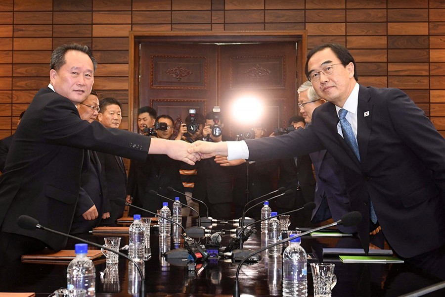 South Korean Unification Minister Cho Myoung-gyon shakes hands with his North Korean counterpart Ri Son Gwon at the truce village of Panmunjom inside the demilitarised zone, North Korea on Monday — Reuters