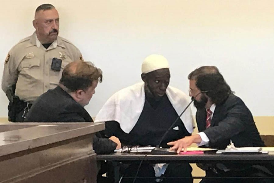 Defense attorney Aleksandar Kostich (R) speaks to defendant Lucas Morton in district court where Morton and five others accused of child abuse were granted bail in Taos County, New Mexico, US August 12. Reuters photo