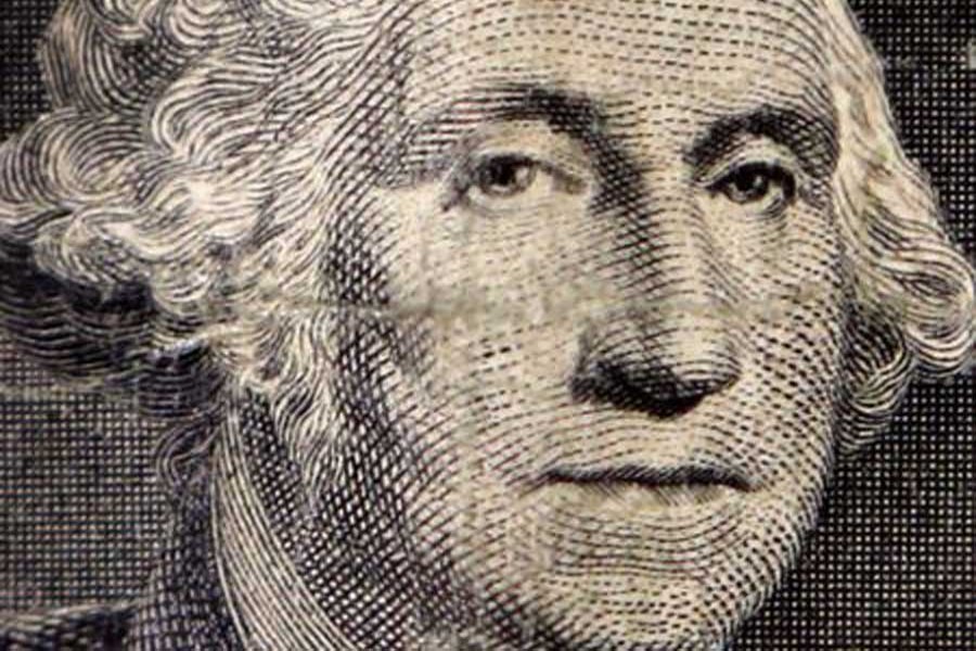 The image of the first US President George Washington on a dollar bill is seen in a photo illustration in Toronto October 15, 2014. Reuters/Files