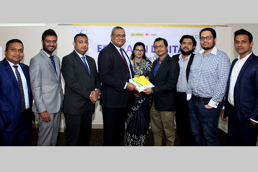 EBL Head of Retail Banking M. Khorshed Anowar and ADN Group Chief of Digital Business and Marketing Ruhullah Raihan Alhusain exchanging documents after signing an agreement at EBL’s head office in Dhaka recently.