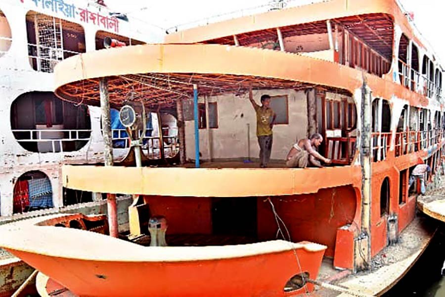 Worker refurbishing and repairing a vessel in Keraniganj ahead of the Eid-ul-Azha recently. Photo: UNB