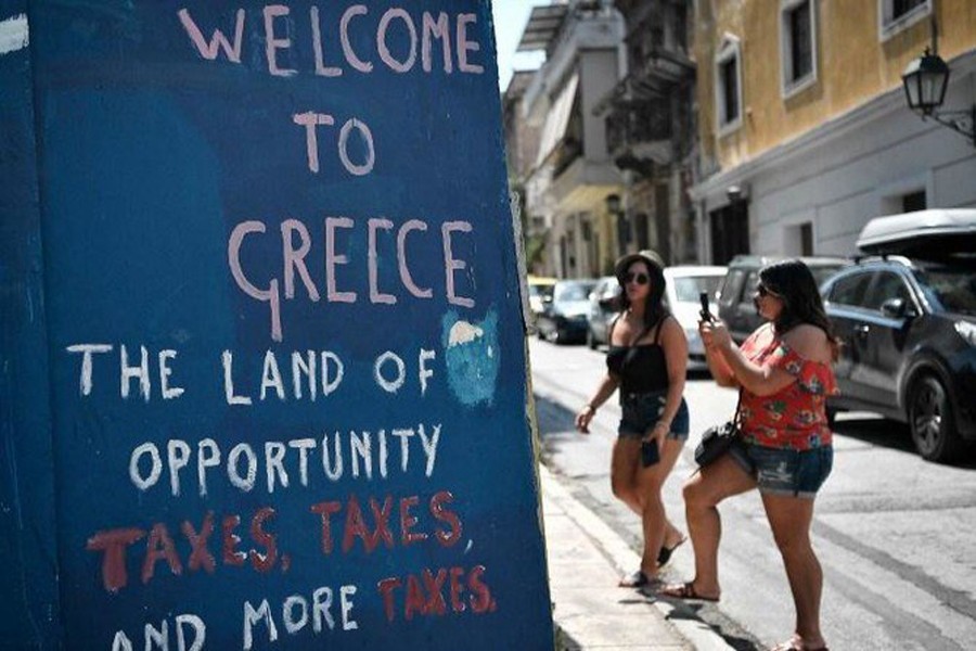 Greek PM heads to Odysseus’ home at end of bailout journey