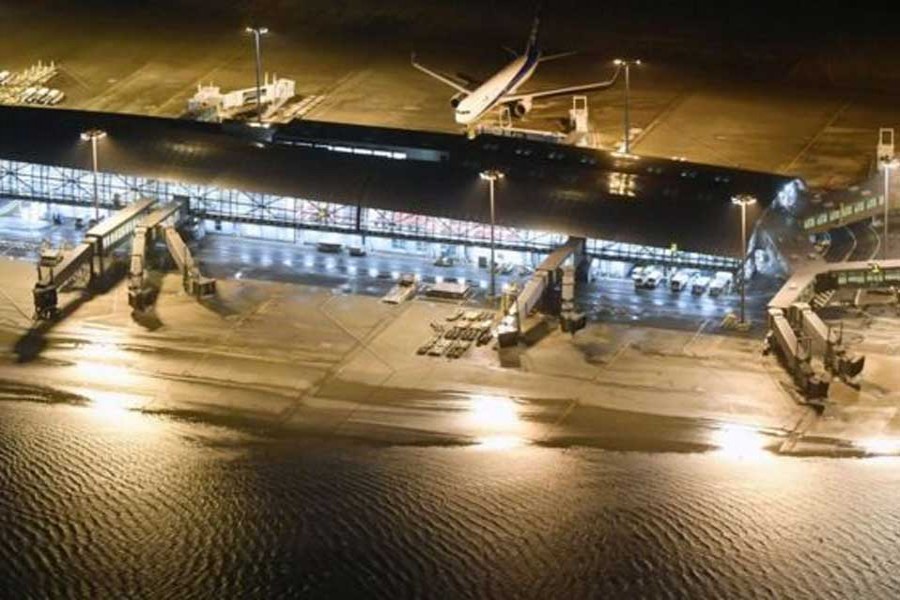 The runway at Kansai airport was flooded          -Reuters