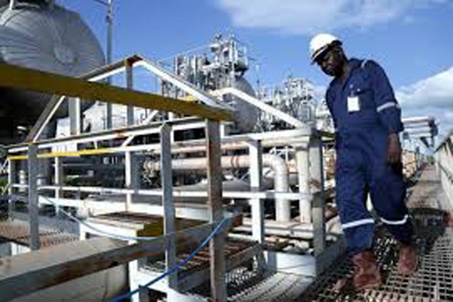 A worker walking by an oil well at the Toma South oil field to Heglig, in Ruweng State, South Sudan     	— Reuters