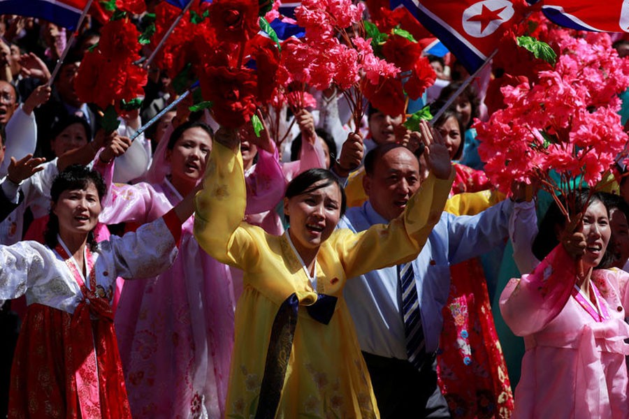 People wave plastic flowers and balloons during a military parade marking the 70th anniversary of North Korea's foundation in Pyongyang, North Korea, September 9, 2018 - Reuters photo