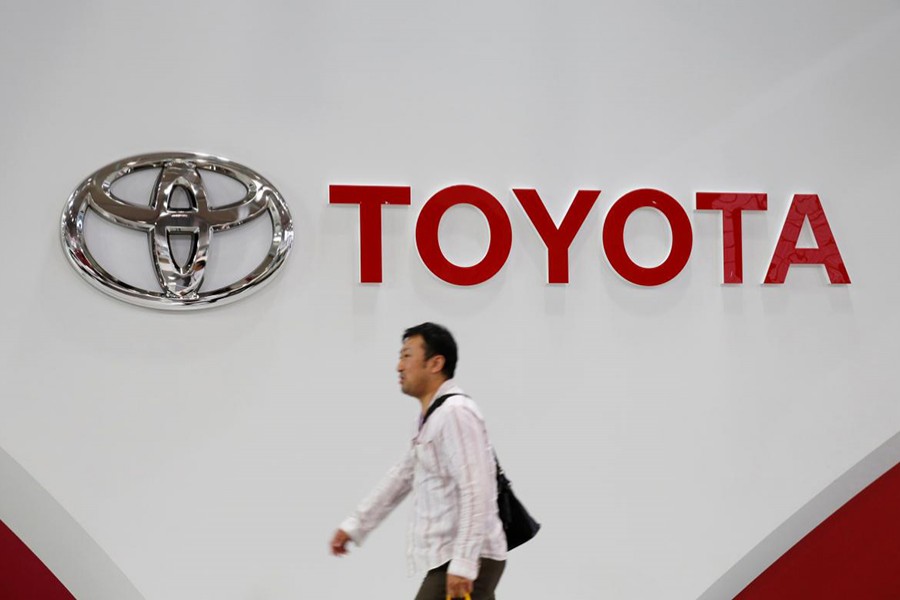 A man walks past a Toyota Motor Corp logo at the company's showroom in Tokyo, Japan on June 14, 2016 — Reuters file photo