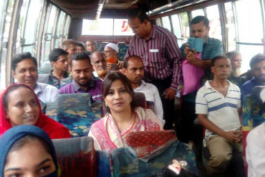 State Minister for Information Tarana Halim taking a public bus in the city on Wednesday