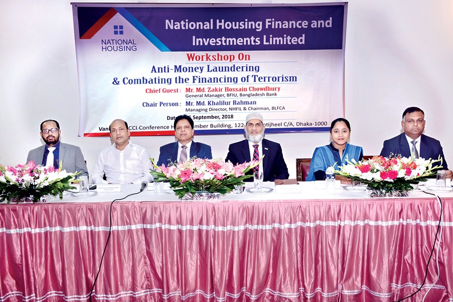 Managing Director of NHFIL Md Khalilur Rahman (third from right) presiding over a workshop on 'Anti-Money Laundering & Combating Financing of Terrorism', organised by the company, in the city on Saturday