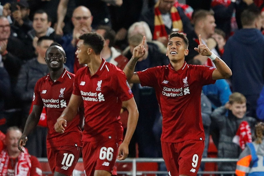 Liverpool's Roberto Firmino looks to the sky as he celebrates the late-winner for his side — Reuters photo