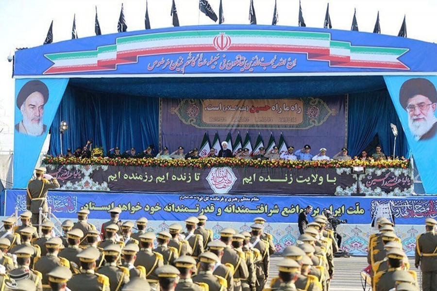 Iranian President Hassan Rouhani delivers a speech during the annual military parade marking in Tehran, Iran on Saturday — Tasnim News Agency photo via Reuters