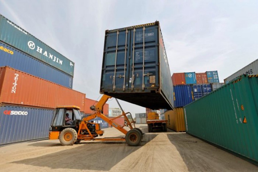 A mobile crane carries a container at Thar Dry Port in Sanand in Gujarat, February 13, 2017. Reuters/Files