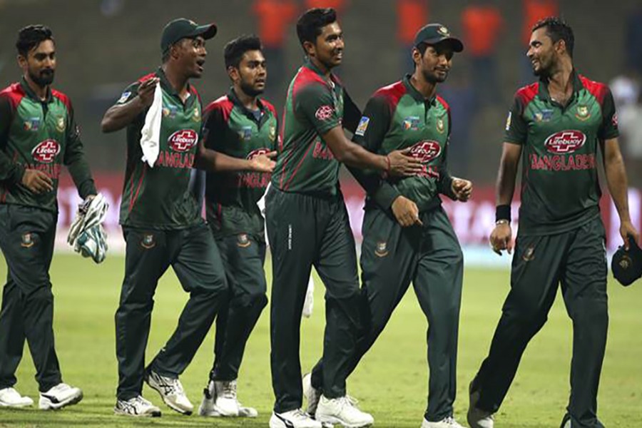 Bangladesh’s captain Mashrafe Mortaza (R) leads his team out of the field — AP file photo