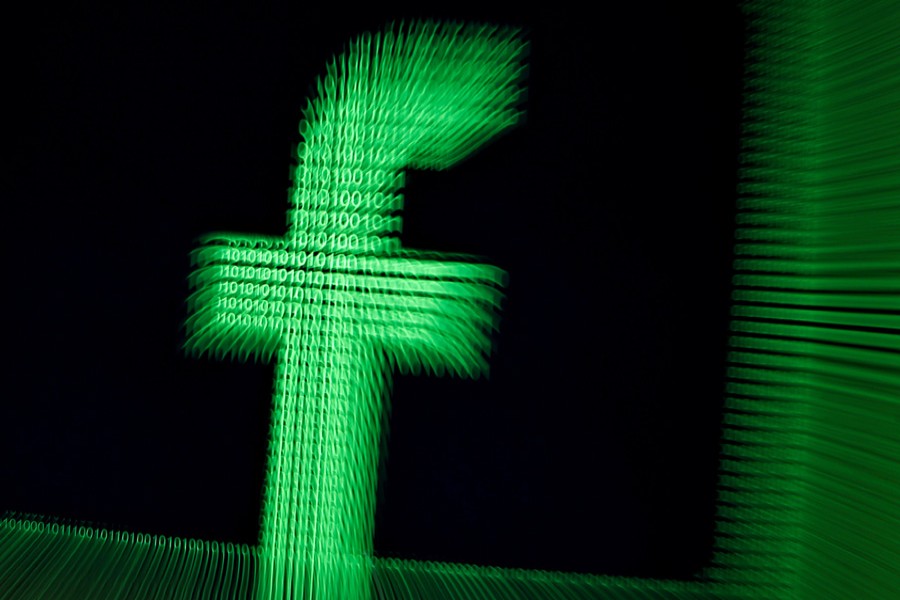 A 3D-printed Facebook logo is seen in front of displayed binary digits in this illustration taken on March 18, 2018. Reuters/Files