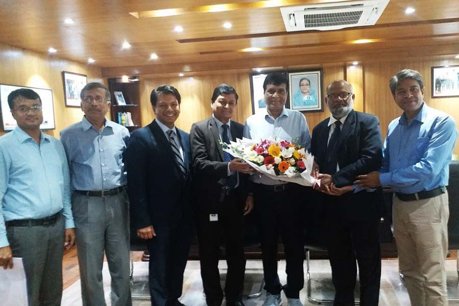 ICSB President Mohammad Sanaullah FCS presenting a bouquet to Chairman of BSEC Dr. M. Khairul Hossain