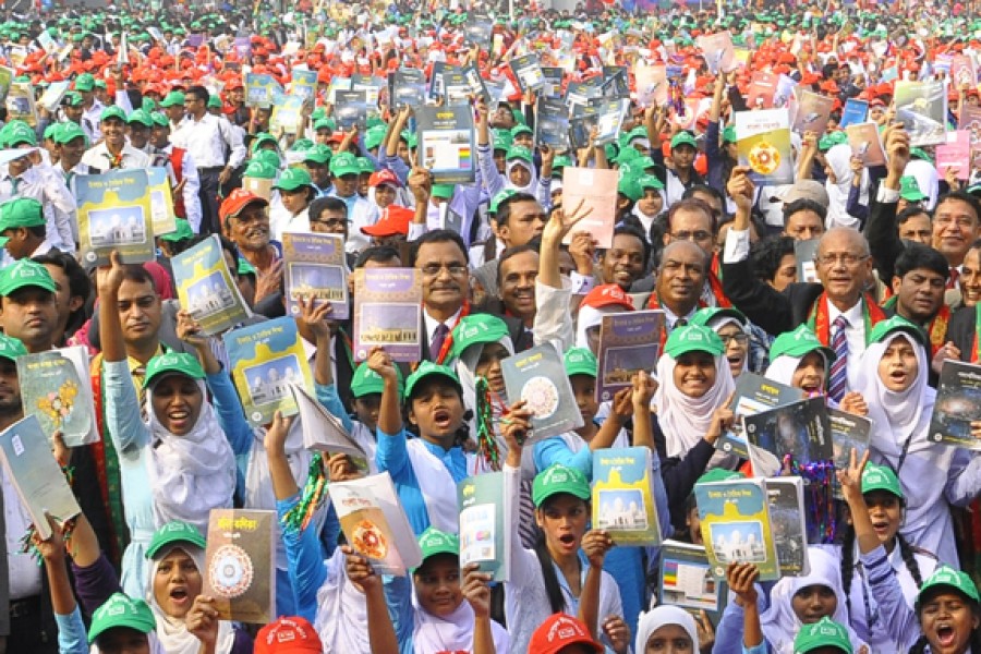 Education Minister Nurul Islam Nahid is seen among the students at the inaugural function of the textbooks festival at Azimpur Government Girls' School and College in Dhaka city, January 01, 2017. FE/Files