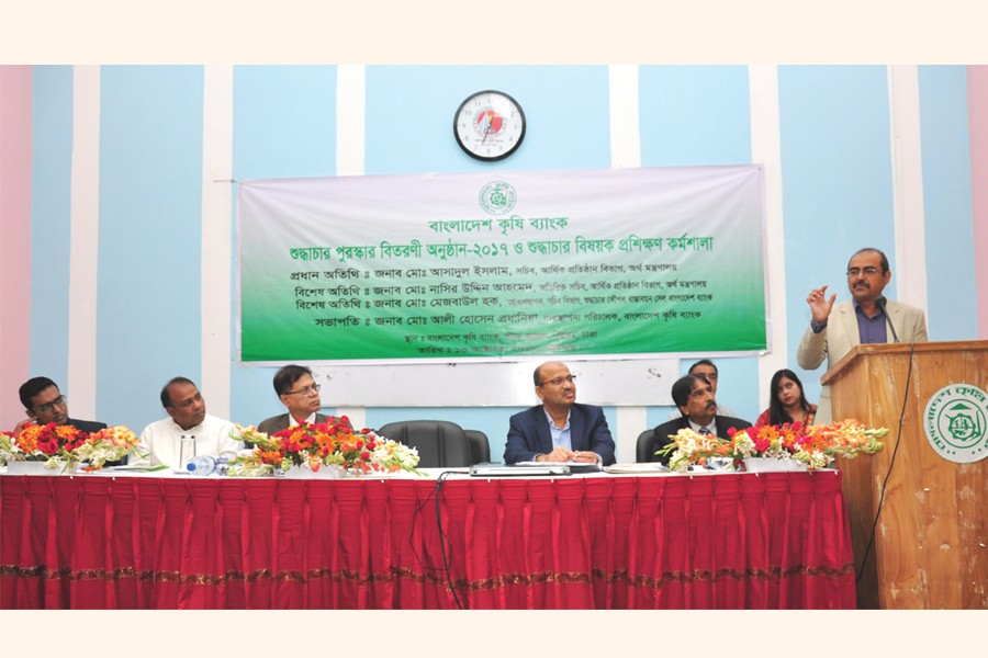 Secretary, Financial Institutions Division of the Ministry of Finance Md. Asadul Islam, Bangladesh Krishi Bank (BKB)’s Managing Director Md. Ali Hossain Prodhania, General Manager for Integrity Policy Implementation Cell of Bangladesh Bank Md. Mezbaul Haque attending the BKB’s Shudhyachar awards-giving ceremony at the BKB Staff College auditorium recently