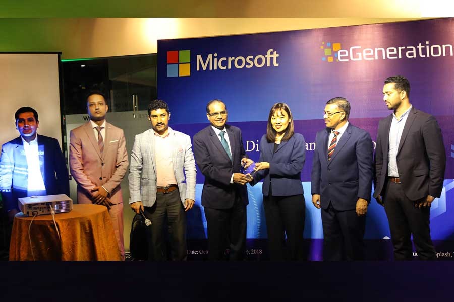 Sook Hoon Cheah, president, South East Asia New Markets of Microsoft, handing over a crest to AKM Shirin, Managing Director, Dutch-Bangla Bank Ltd in a programme, jointly arranged by eGeneration and Microsoft to mark the celebration of five successful major implementations of Microsoft solutions during the July- September quarter recently. Shameem Ahsan (3rd from left), Chairman of eGeneration, also seen