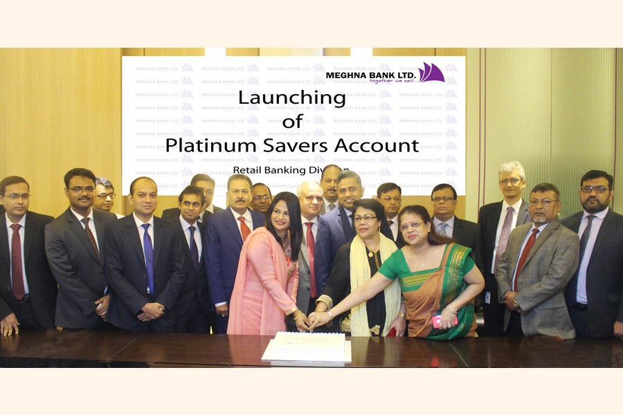 Managing Director and CEO of Meghna Bank Limited Adil Islam inaugurating the 'Platinum Savers Account' of the bank's Retail Banking Division by cutting a cake in the capital recently with Additional Managing Director Johora Bebe and SEVP and Head of the Retail Banking Division Md. Ariful Islam Choudhury present