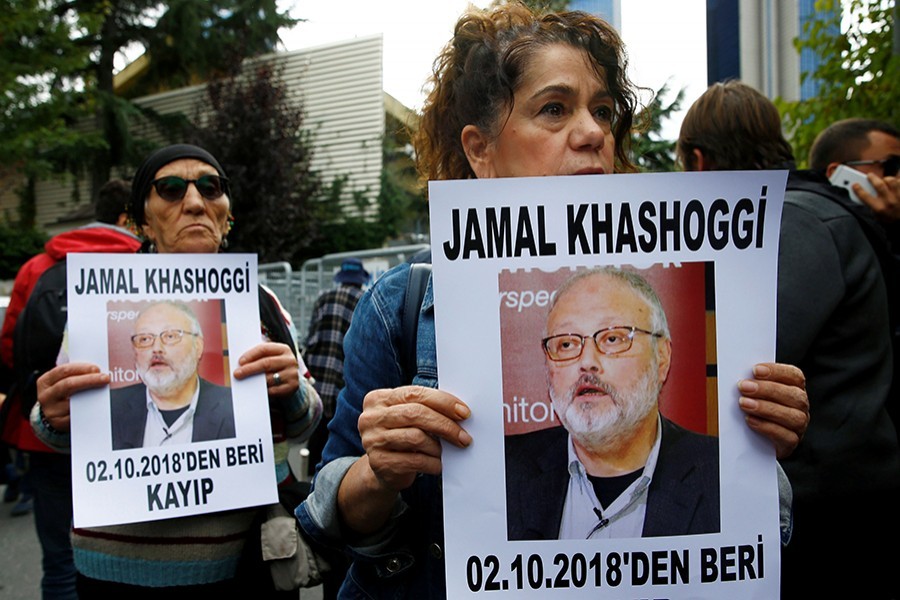 Human rights activists hold pictures of Saudi journalist Jamal Khashoggi during a protest outside the Saudi Consulate in Istanbul, Turkey Tuesday last — Reuters photo