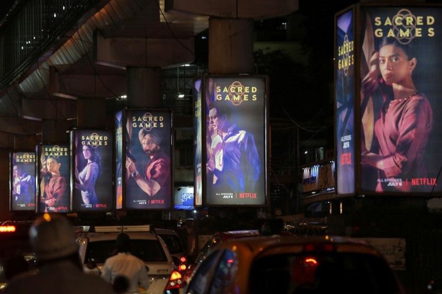 Traffic moves on a road past hoardings of Netflix's new television series "Sacred Games" in Mumbai, India, July 11, 2018. Reuters/Files