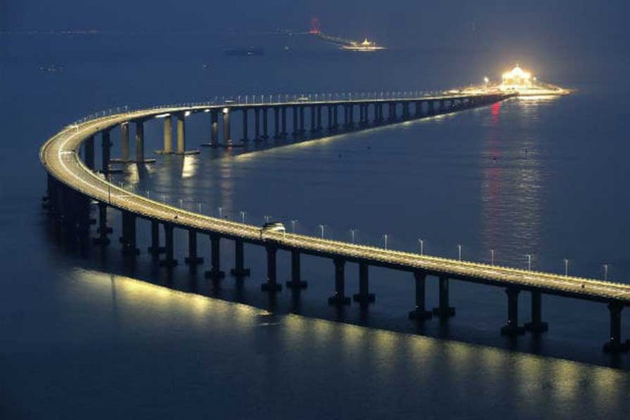 China opens longest sea-crossing bridge