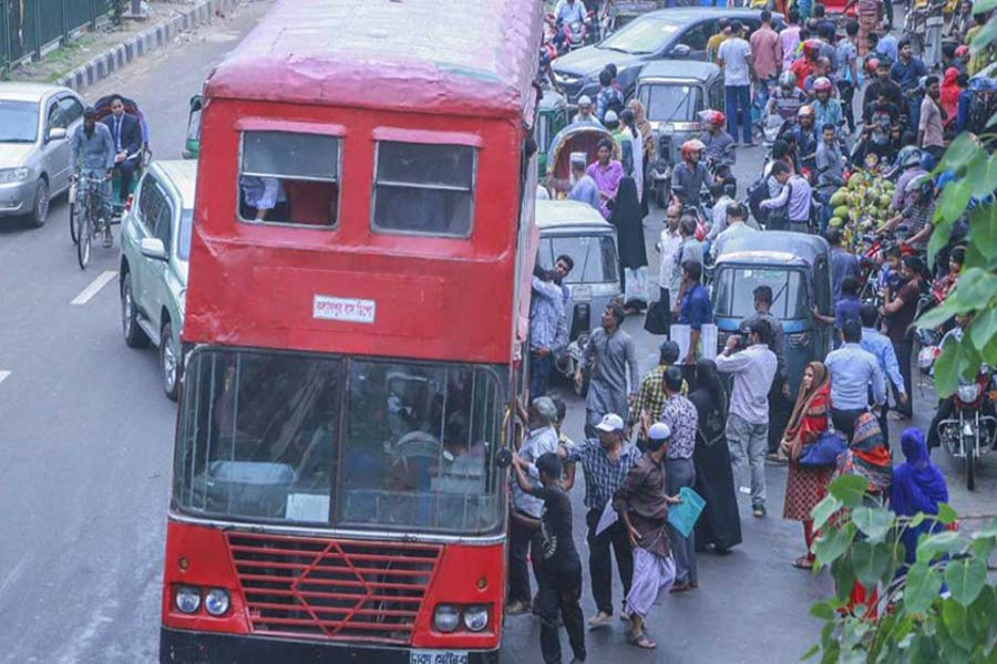 Commuters flocking towards sole BRTC transport as no other public transports were plying on the city roads on the first day of 48-hour transport strike on Sunday, October 28, 2018. Photo: UNB