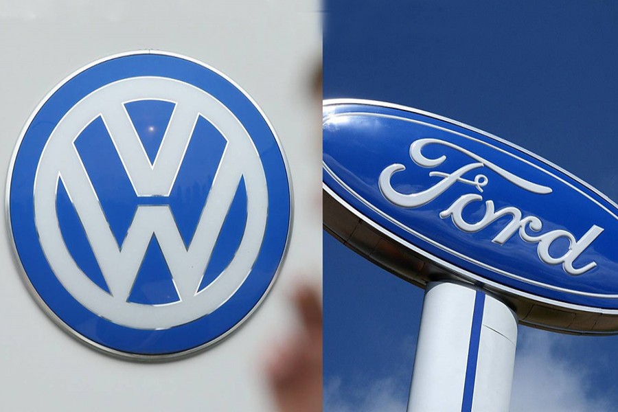 The logos of Volkswagen (L) and Ford Motor seen in this photo collage