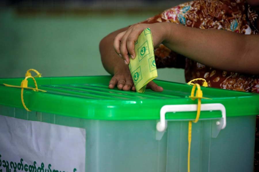 A voter cast her ballot for the by-election in Yangon, Myanmar, November 3, 2018. Reuters