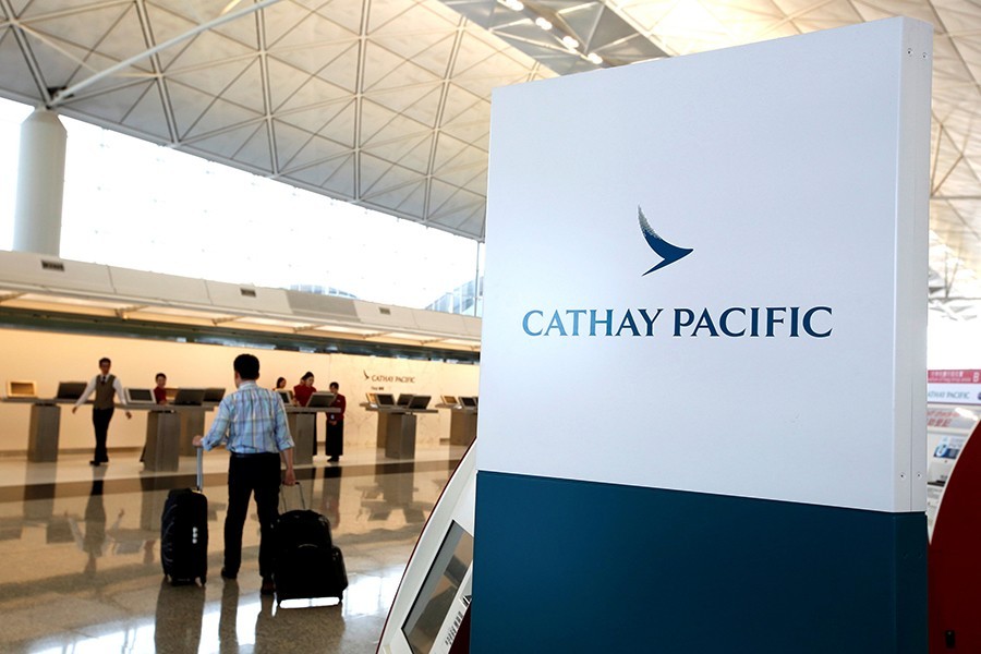 A passenger walks to the First Class counter of Cathay Pacific Airways at Hong Kong Airport in Hong Kong, China on April 4, 2018 — Reuters/File