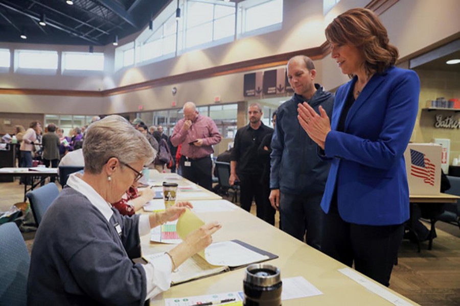 Democratic congressional candidate Cindy Axne gets her ballot for the mid-term elections at her polling station in West Des Moines, Iowa, US on Tuesday — Reuters photo