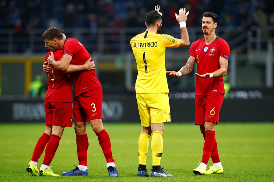 Portugal's Rui Patricio and Jose Fonte celebrate after progressing in the Nations League — Reuters photo