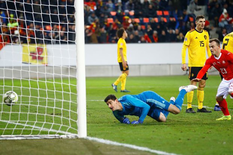 Belgium's Thibaut Courtois looks dejected after conceding their third goal scored by Switzerland's Haris Seferovic — Reuters photo