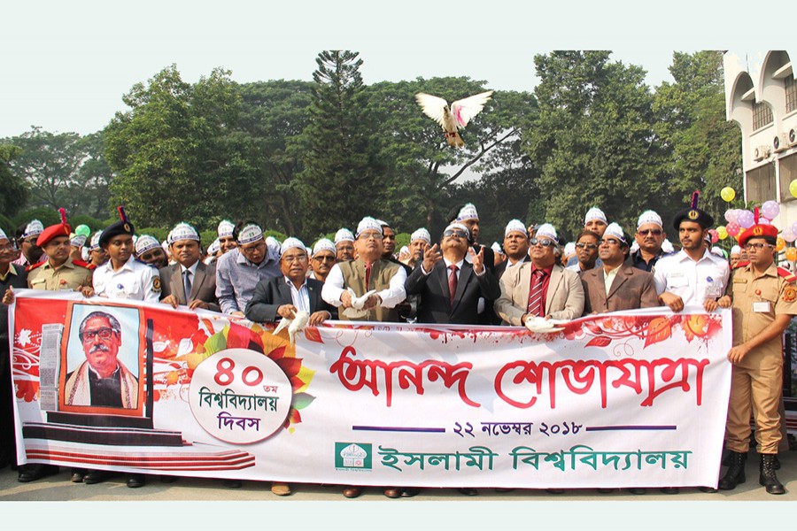 Islamic University Vice-Chancellor Professor M Harun-Ur-Rashid Askari inaugurate the programmes by releasing pigeons on the campus in Kushtia on Thursday. Photo: UNB