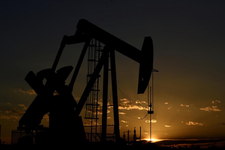 A pump jack on a lease owned by Parsley Energy operates at sunset in the Permian Basin near Midland, Texas, US, August 23, 2018. Reuters/File Photo