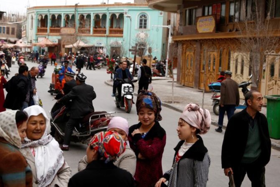 People mingle in the old town of Kashgar, Xinjiang Uighur Autonomous Region, China on March 22, 2017 - Reuters File/ Thomas Peter