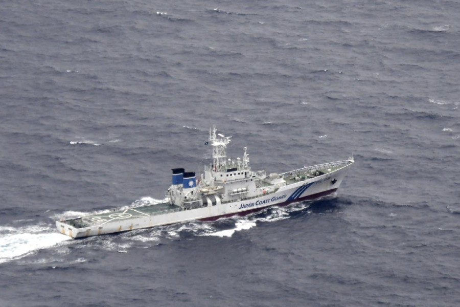 A Japan Coast Guard patrol vessel sails on the water at the area where two US Marine Corps aircraft have been involved in a mishap in the skies, off the coast of Kochi prefecture, Japan, in this aerial view photo taken by Kyodo December 6, 2018 - Kyodo/via REUTERS