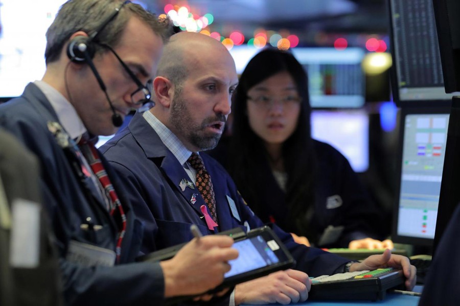 Traders work on the floor of the New York Stock Exchange (NYSE) in New York, US, December 7, 2018. Reuters