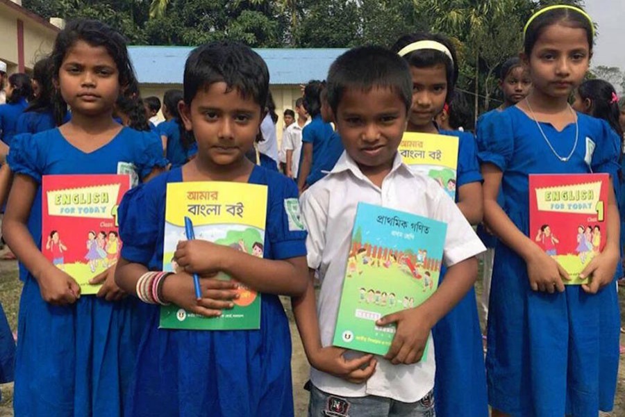 Students receiving books on the first day of 2018 in Cumilla. Photo: Collected