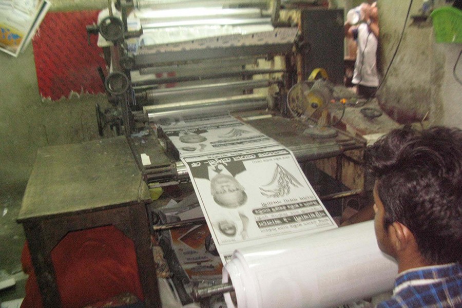 Printing press workers across the capital passing a hectic time to cater to the soaring demand of campaigners ahead of the 11th national election. The photo was taken from the city’s Fakirapool area on Wednesday — Collected