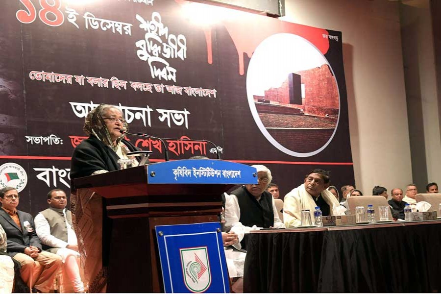 Prime Minister Sheikh Hasina speaking at a programme arranged by Awami League at Bangladesh Krishibid Institution on the occasion of the Martyred Intellectuals Day in the city on Friday. - PID