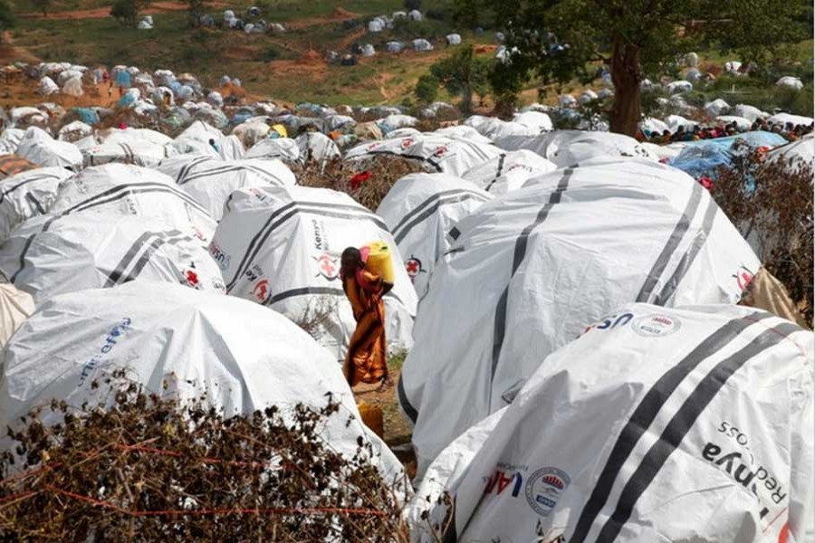 In this Reuters file photo, an Ethiopian girl carries water at the Somare refugee camp on the Ethiopian-Kenyan border near the town of Moyale, Kenya.