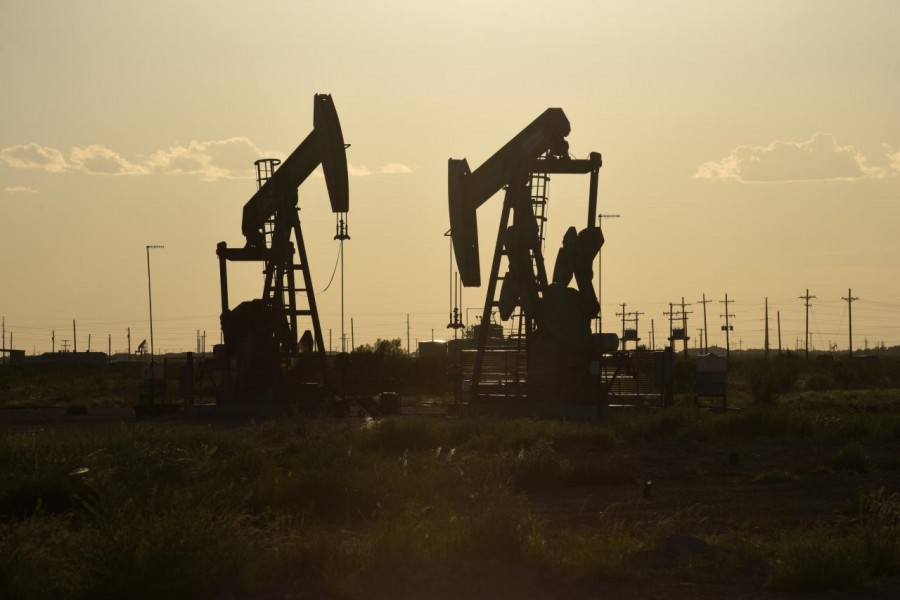 Pump jacks operate in an oil field in Midland, Texas, US August 22, 2018. Reuters