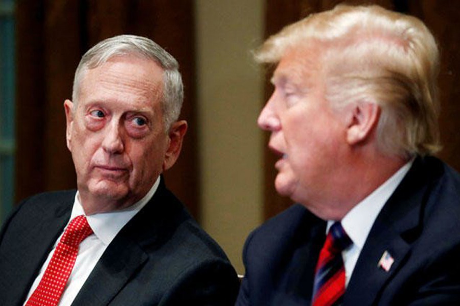 US Defense Secretary James Mattis listens as US President Donald Trump speaks to the news media while gathering for a briefing from his senior military leaders in the Cabinet Room at the White House in Washington, US, October 23, 2018. Reuters/File Photo