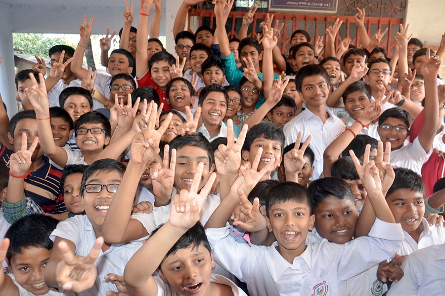 Jubilant students of Chattogram Collegiate School flash the victory sign as they celebrate their success in the PEC exam — Focus Bangla/File