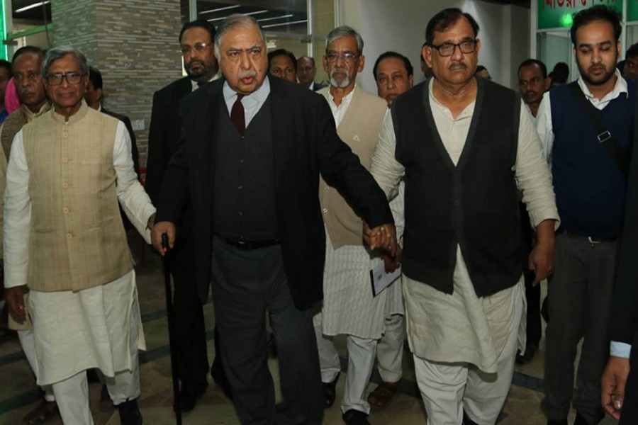 Jatiya Oikyafront leaders, led by Dr Kamal Hossain, walking out of a meeting with the Election Commission (EC) on Tuesday, December 25, 2018