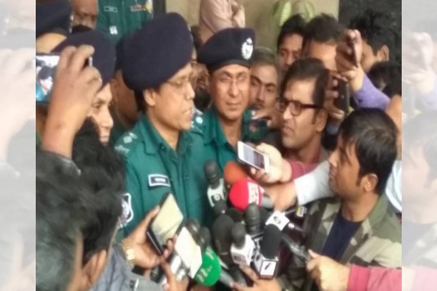 A concerned police official speaks to the reporters at Dr Kamal's Motijheel chamber on Wednesday — Photo via UNB