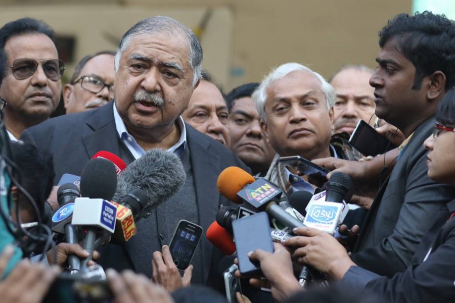 Jatiya Oikyafront chief Dr Kamal Hossian talking to reporters after casting his vote at Voqarunnisa Noon School centre in the morning. Photo: UNB