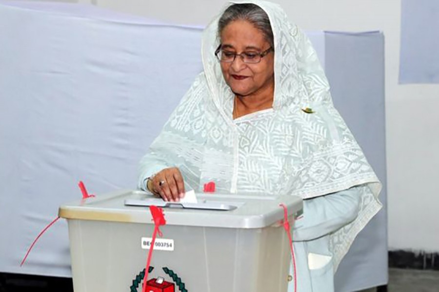 PM Sheikh Hasina, who has been in power since 2009, casts her ballot on Sunday. Reuters