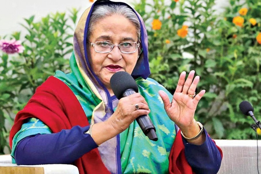 Prime Minister Sheikh Hasina speaking at a view exchange meeting with foreign election observers at Ganobhaban in the city on Monday — Focus Bangla